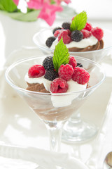 Chocolate mousse with raspberries and cream.