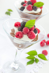 Chocolate mousse with raspberries and cream.