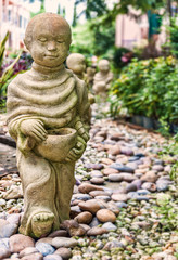 Fototapeta na wymiar Funny traditional Thai garden sculpture