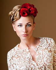 fashion model with hairstyle and flowers in her hair.