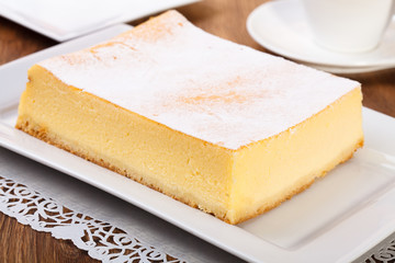 The composition of delicious cheesecake served with strawberries