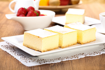 The composition of delicious cheesecake served with strawberries