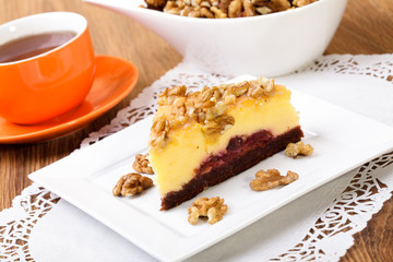 Cheesecak with a cap of coffee or tea