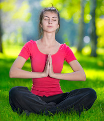 Young woman doing yoga exercises