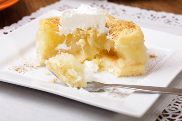 Delicious apple pie with whipped cream (eating cake)