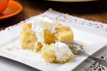 Delicious apple pie with whipped cream (eating cake)