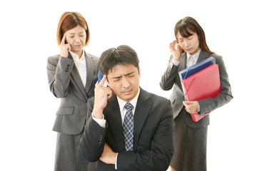苦悩するビジネスマンとOL