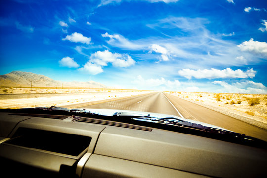 Dashboard Seen While Driving Hot Desert Road