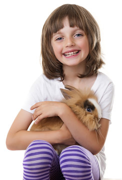 little girl with her baby rabbit