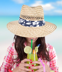 Portrait of a beautiful young girl with cocktail