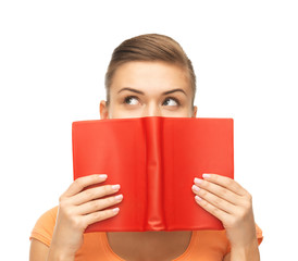 woman eyes and hands holding red book