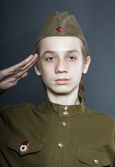 Teenage boy dressed in soviet uniform