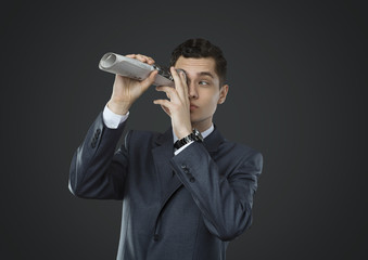 Man looking through a telescope