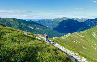 Fototapeta na wymiar Summer Tatra Mountain (Poland) and family on path