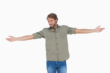 Happy man with arms outstretched