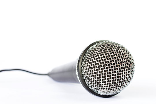 Microphone with black wire isolated on white