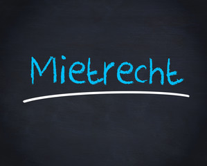 Obraz premium Mietrecht word written in blue on a blackboard