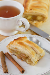 strudel with cinnamon with cup of tea
