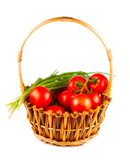 Wicker basket with tomato and green onion