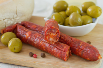sausages with bread and olives