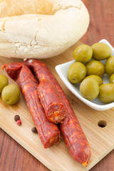 sausages with olives and bread