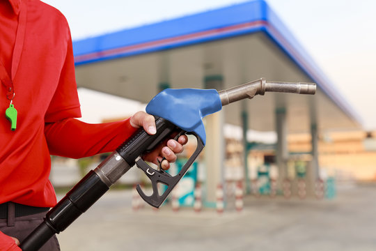 Service Station Worker In Gas Station