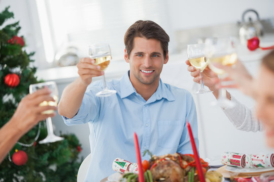 Family toasting at christmas dinner