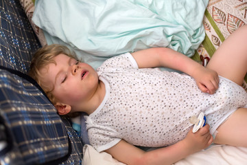 Little boy sleeping in his bed