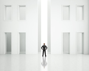 businessman standing in bright office