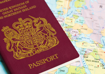 Passport or visa lying on a world map