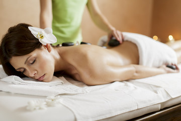 Fototapeta na wymiar Hot stone massage therapy