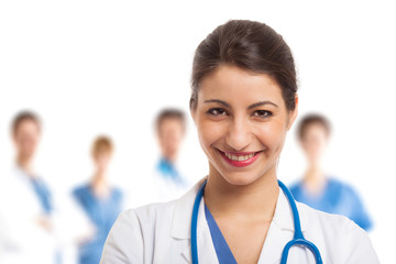 Smiling nurse in front of her team