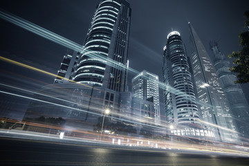 The highway car light trails of modern urban buildings