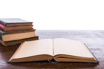 Open old vintage book on wooden table