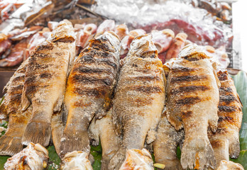 Grilled Tilapia fish in street market of Thailand