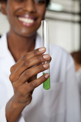 Teacher Holding Chemical Solution In Test Tube