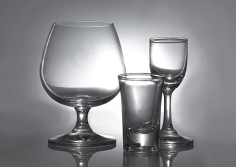 Glass with water on background
