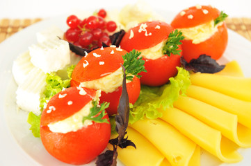 Tomatoes stuffed with cheese, beautifully decorated.