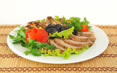 Meat, cut into slices beautifully decorated.