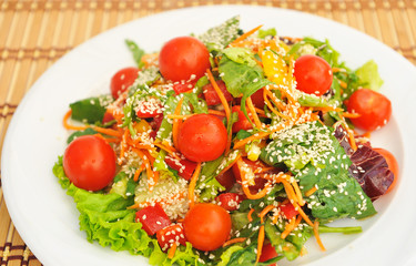 Cherry tomatoes and sesame seeds.