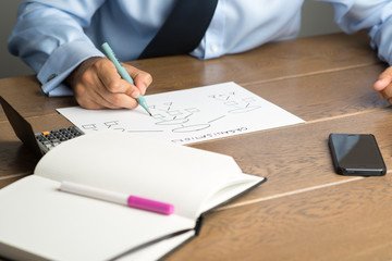 Businessman working on organisation chart