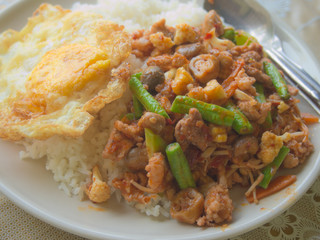 Closeup of stir-fried spicy mixed vegetables with rice and egg