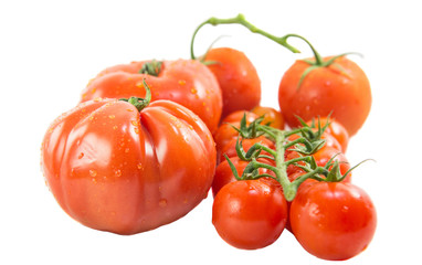 A group of various type and sizes of tomatoes