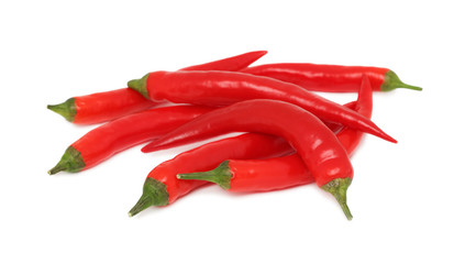 Pile of red chilli peppers on white background
