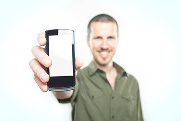 Youn man showing a smart phone