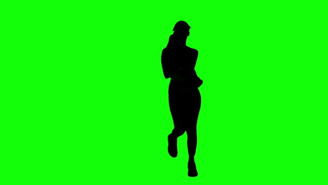 Silhouette of woman running on green screen