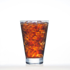 Sparkling cola drinks whit soda and ice in glass isolated on whi