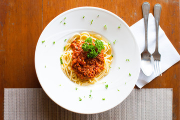 spaghetti bolognese on table and spoon