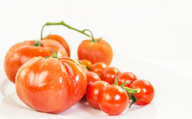 A group of various type and sizes of tomatoes