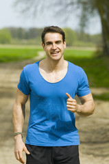 Fototapeta premium smiling man jogging